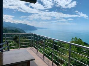 a balcony with a view of the water at Mari's hotel sarpi in Batumi