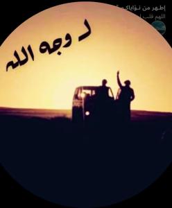 two people standing on top of a car in the desert at القويرة in El Quweira