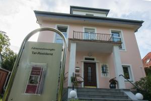 a house with a sign in front of it at Tal-Residenz Whg 3 in Bad Salzuflen