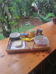 a tray of food on a table on a table at ApartHotel Villa Pacande & Rooms in Alajuela