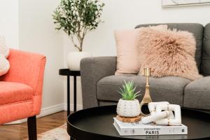 a living room with a couch and a coffee table at Fabulous Home-King bed-Easy Access to EVERyTHING! in Edmonton