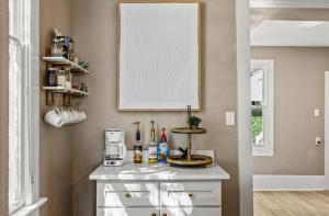 a kitchen with a counter with a coffee maker on it at Sand and Sea Manor in Galveston +51 photos