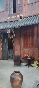 a large vase sitting in front of a building at VNJ Capsule 159 in Hoi An +30 photos