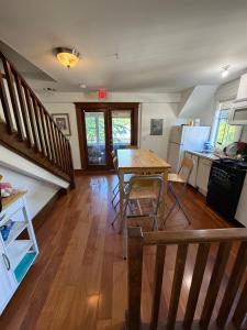 a kitchen and dining room with a table and chairs at Van Guesthouse in Vancouver