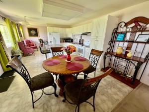 a kitchen and dining room with a table and chairs at Imperial Ranchettes GuestSuite in Lone Butte