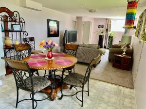 a living room with a table and chairs at Imperial Ranchettes GuestSuite in Lone Butte +27 photos