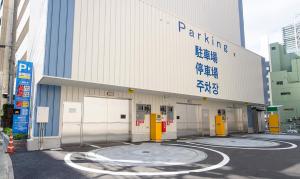 a parking lot in front of a building at Hotel Wing Port Nagasaki in Nagasaki