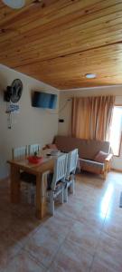 a living room with a table and chairs and a couch at Villa Sol in San Ignacio