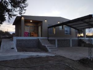 a house is being constructed with a building at Villa Sol in San Ignacio
