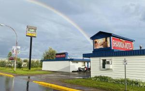 a rainbow in the sky above a fast food restaurant at Shannon Motel in Fort Nelson +15 photos