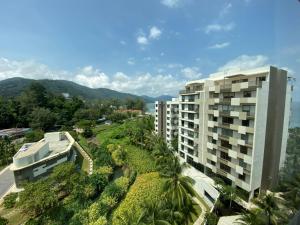 an aerial view of a building with palm trees at By The Sea - UBTS SMART ENTERPRISE in Batu Ferringhi