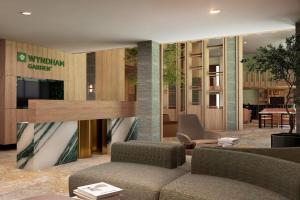 a lobby of a hotel with a couch and chairs at Wyndham Garden Durango in Durango