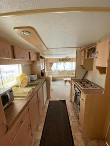 a kitchen in an rv with a stove at Ingoldmells holiday in Ingoldmells