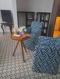 a living room with a couch and a coffee table at butterfly lodge in Brufut