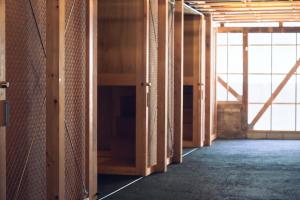 an empty room with wooden walls and a large window at 一棟貸しホテル Shirahama WAKO in Shirahama