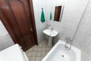 a bathroom with a sink and a toilet and a mirror at Hotel Voikovsky in Moscow