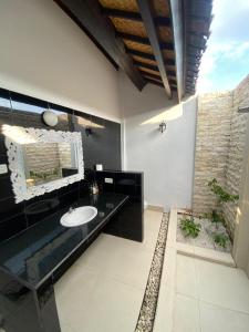 a bathroom with a sink and a mirror at Inti Bungalows in Gili Trawangan +60 photos