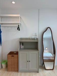a dressing room with a mirror and a dressing table at Cat House BKK in Bangkok +39 photos