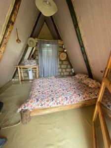 a bed in a room in a tent at Eschato tented camp in Gilgil