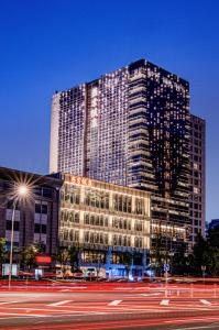 a tall building with a street in front of it at YANJING Hotel 北京燕京饭店 in Beijing