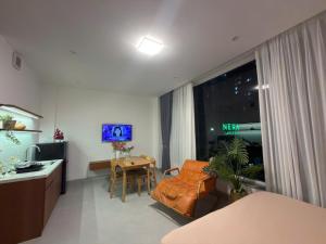 a living room with a couch and a table at BEER HOMESTAY Huế - FREE POOL & GYM in Hue