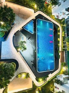 an overhead view of a swimming pool in a city at BEER HOMESTAY Huế - FREE POOL & GYM in Hue