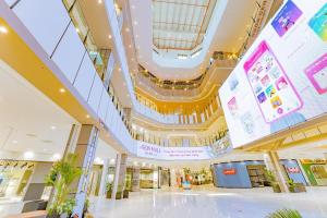a large shopping mall with a large ceiling at BEER HOMESTAY Huế - FREE POOL & GYM in Hue