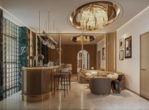 a living room with a bar in the middle of a room at La Passion Elegance Hotel & Spa in Hanoi