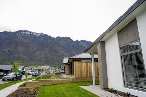a house with a view of a mountain at Southern Peaks Hideaway in Queenstown Airport