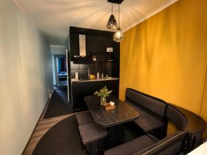 a living room with a couch and a table at Joy Fergana Guesthouse in Fergana