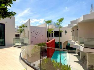a view of a house with a swimming pool at The Rachata at Ayothaya in Ban Khlong Takhian
