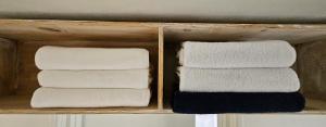 two sets of towels in a wooden box at 스테이 노랑 stay norang in Daegu +24 photos