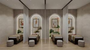 a room with a row of beds and chairs at Sealand hotel & spa in Dong Hoi