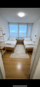 a large room with two beds and a ladder at FeWo am Deich im Columbus Center mit Pool und Aufzug in Bremerhaven +36 photos
