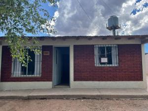 a brick building with a water tower on top of it at Casa VYB in Malargüe