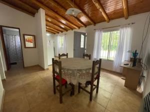 a dining room with a table and chairs at Casa VYB in Malargüe