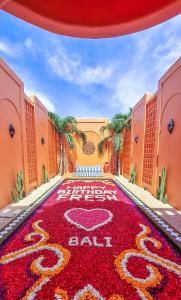 a hotel with a red carpet with the words baby on it at Güzel Villa Bali in Badung