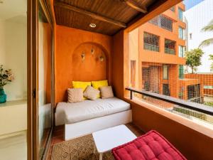 a small balcony with a bench and a window at Las Tortugas beach front condo in Khao Tao +23 photos