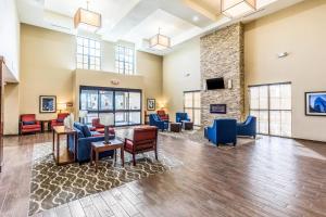 a lobby with furniture and a fireplace at Comfort Suites Channelview - Houston East in Channelview
