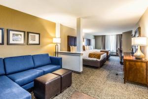 a hotel room with a couch and a bed at Comfort Suites Channelview - Houston East in Channelview +31 photos