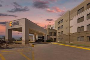 a rendering of a hospital building at dusk at Comfort Inn & Suites Wichita Northeast in Wichita