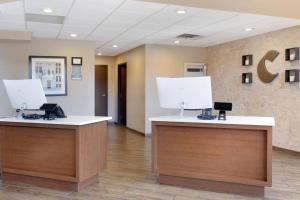 a lobby of a hospital with two reception desks at Comfort Inn & Suites Wichita Northeast in Wichita +38 photos