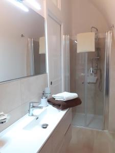 a bathroom with a sink and a shower at A Levante in Putignano +27 photos