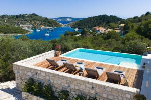 a villa with a pool and a view at Villa Porto Mongonisi in Porto Ozias