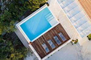an overhead view of a swimming pool on a house at Villa Porto Mongonisi in Porto Ozias