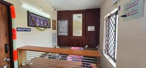 a classroom with a wooden bench in a room at Kodai blue residency in Kodaikānāl