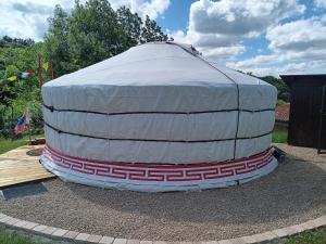 a large dome tent sitting on the ground at Notre yourte mongole in Chevinay