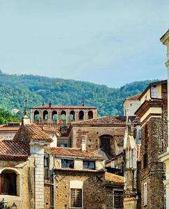 a group of buildings in a city with hills in the background at Il Rigoletto Casa Vacanze in Lamezia Terme