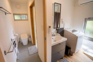 a bathroom with a sink and a toilet at The Whale House 日光 by Silver Daisy in Nikko +26 photos