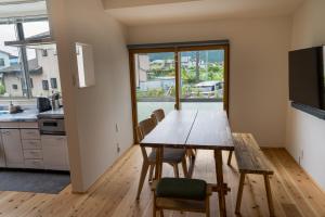 a kitchen and dining room with a table and chairs at The Whale House 日光 by Silver Daisy in Nikko